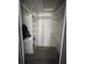 Walk-in closet with built-in shelving and wood-look tile flooring at 2619 Albion St, Holiday, FL 34691