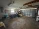 Spacious garage featuring ample storage and an overhead door, perfect for vehicles and projects at 2619 Albion St, Holiday, FL 34691