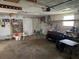 Spacious garage featuring ample storage and an overhead door, perfect for vehicles and projects at 2619 Albion St, Holiday, FL 34691