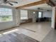 Spacious living room with tile floors and natural light from the windows at 2619 Albion St, Holiday, FL 34691