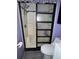 Bathroom shower with glass sliding door, modern fixtures, and white tile surround at 2619 Albion St, Holiday, FL 34691