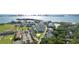Breathtaking aerial view capturing the scenic waterfront community with golf courses and well-manicured landscapes at 302 Eastleigh Dr, Belleair, FL 33756