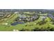 Scenic aerial view overlooking a golf course community featuring lush landscaping and serene water features at 302 Eastleigh Dr, Belleair, FL 33756