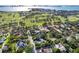 Desirable neighborhood homes near the golf course and waterfront with city views in the distance at 302 Eastleigh Dr, Belleair, FL 33756