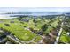 Breathtaking aerial view showcasing a golf course with a stunning waterfront backdrop at 302 Eastleigh Dr, Belleair, FL 33756