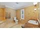 Bathroom featuring a toilet, heated towel rack, shower, and a sink with granite countertop at 302 Eastleigh Dr, Belleair, FL 33756
