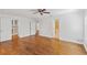 Spacious bedroom with hardwood floors, multiple closets, and access to an en-suite bathroom at 302 Eastleigh Dr, Belleair, FL 33756
