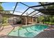 Screened-in pool area with brick paving, creating a private outdoor living space at 302 Eastleigh Dr, Belleair, FL 33756