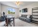 Comfortable room featuring a futon, study area, and scenic view at 3029 Brookfield Ln, Clearwater, FL 33761