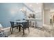 Open dining area next to kitchen with modern decor, stylish chairs, and plenty of natural light at 3029 Brookfield Ln, Clearwater, FL 33761