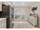 Bright kitchen featuring updated appliances, sleek countertops, and a cozy breakfast nook with natural light at 3029 Brookfield Ln, Clearwater, FL 33761