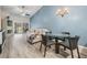 Bright living room with vaulted ceilings, a ceiling fan, modern furnishings, and sliding glass doors to the patio at 3029 Brookfield Ln, Clearwater, FL 33761