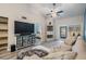 Sun-filled living area with wood floors, vaulted ceiling and sliding doors to the lanai at 3029 Brookfield Ln, Clearwater, FL 33761