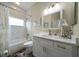 Stylish bathroom with tub, shower, vanity and a large mirror providing an open and airy feel at 3137 Banyan Hill Ln, Land O Lakes, FL 34639