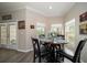 Cozy breakfast nook with round table and bay window offering plenty of natural light and view of backyard at 3137 Banyan Hill Ln, Land O Lakes, FL 34639