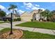 Inviting single-story home showcasing a manicured lawn and charming curb appeal at 3137 Banyan Hill Ln, Land O Lakes, FL 34639