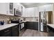 Modern kitchen featuring stainless steel appliances and ample storage at 3137 Banyan Hill Ln, Land O Lakes, FL 34639