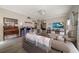 Cozy living room featuring wood floors, a ceiling fan and neutral tones at 3137 Banyan Hill Ln, Land O Lakes, FL 34639