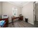 Cozy office with wood floors, crown molding, a desk and a window at 3137 Banyan Hill Ln, Land O Lakes, FL 34639