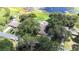 Aerial view of home with lake access and dock at 35836 Lakeshore Dr, Dade City, FL 33525
