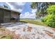 Covered porch and patio overlooking backyard with view of lake at 35836 Lakeshore Dr, Dade City, FL 33525