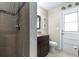 Bathroom showcases a modern tiled shower and marine themed wall decor at 35836 Lakeshore Dr, Dade City, FL 33525