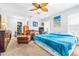 Cozy bedroom with a leather chair, desk, and ample closet space at 35836 Lakeshore Dr, Dade City, FL 33525