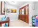 Welcoming foyer with decorative accents and a stylish front door at 35836 Lakeshore Dr, Dade City, FL 33525