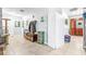 The hallway features storage with decorative accents and a tiled floor at 35836 Lakeshore Dr, Dade City, FL 33525