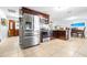 Open kitchen featuring stainless steel appliances and dark wood cabinets at 35836 Lakeshore Dr, Dade City, FL 33525