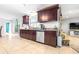 Spacious kitchen with stainless steel appliances and dark wood cabinetry at 35836 Lakeshore Dr, Dade City, FL 33525