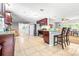 Open kitchen layout with an island and bar seating, perfect for entertaining guests at 35836 Lakeshore Dr, Dade City, FL 33525