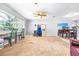 Open living room with a ceiling fan, neutral tones, and dining area at 35836 Lakeshore Dr, Dade City, FL 33525