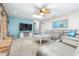 Comfortable living room with stone accent wall and ample natural light at 35836 Lakeshore Dr, Dade City, FL 33525