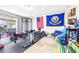 Home workout room, complete with weightlifting equipment and natural light at 35836 Lakeshore Dr, Dade City, FL 33525