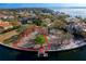 Expansive waterfront lot with a dock, outlined in red, perfect for building a custom home at 38 Ladoga Ave, Tampa, FL 33606