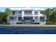 Luxury waterfront home with a stunning pool, waterfall feature, covered balconies, and lush landscaping at 38 Ladoga Ave, Tampa, FL 33606