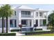 Luxury waterfront property boasting a serene pool with waterfall, covered balconies, and manicured landscaping at 38 Ladoga Ave, Tampa, FL 33606
