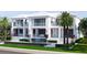 Beautiful waterfront home with a pool, waterfall, covered balconies, and lush landscaping at 38 Ladoga Ave, Tampa, FL 33606