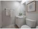 Bright bathroom with a white vanity, framed art, and a well-lit mirror at 403 S Fremont Ave # 3, Tampa, FL 33606