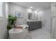 Serene bathroom featuring a soaking tub, dual vanity, and modern fixtures at 403 S Fremont Ave # 3, Tampa, FL 33606