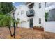 Charming two-story home showcasing a well-kept exterior, black awnings and brick driveway at 403 S Fremont Ave # 3, Tampa, FL 33606