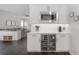 Contemporary kitchen featuring stainless steel wine fridge, microwave, and modern cabinetry at 403 S Fremont Ave # 3, Tampa, FL 33606