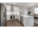 Modern kitchen featuring quartz counters, stainless steel appliances and white subway backsplash at 403 S Fremont Ave # 3, Tampa, FL 33606