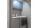 Functional laundry room with blue cabinets, washer, and dryer at 403 S Fremont Ave # 3, Tampa, FL 33606