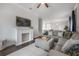 Spacious living room featuring a decorative fireplace, plush seating, and an open layout at 403 S Fremont Ave # 3, Tampa, FL 33606