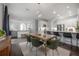 Open living space with modern chandelier, stainless steel appliances, and an open living concept at 403 S Fremont Ave # 3, Tampa, FL 33606