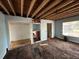 View of a living room under renovation showcasing open beam ceiling at 4050 Iris N St, St Petersburg, FL 33703