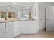 Bathroom vanity with ample counter space, storage cabinets and large mirror at 4399 Dior Rd, Spring Hill, FL 34609