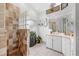 Stylish bathroom featuring a walk-in shower, tiled floors, and modern fixtures at 4399 Dior Rd, Spring Hill, FL 34609